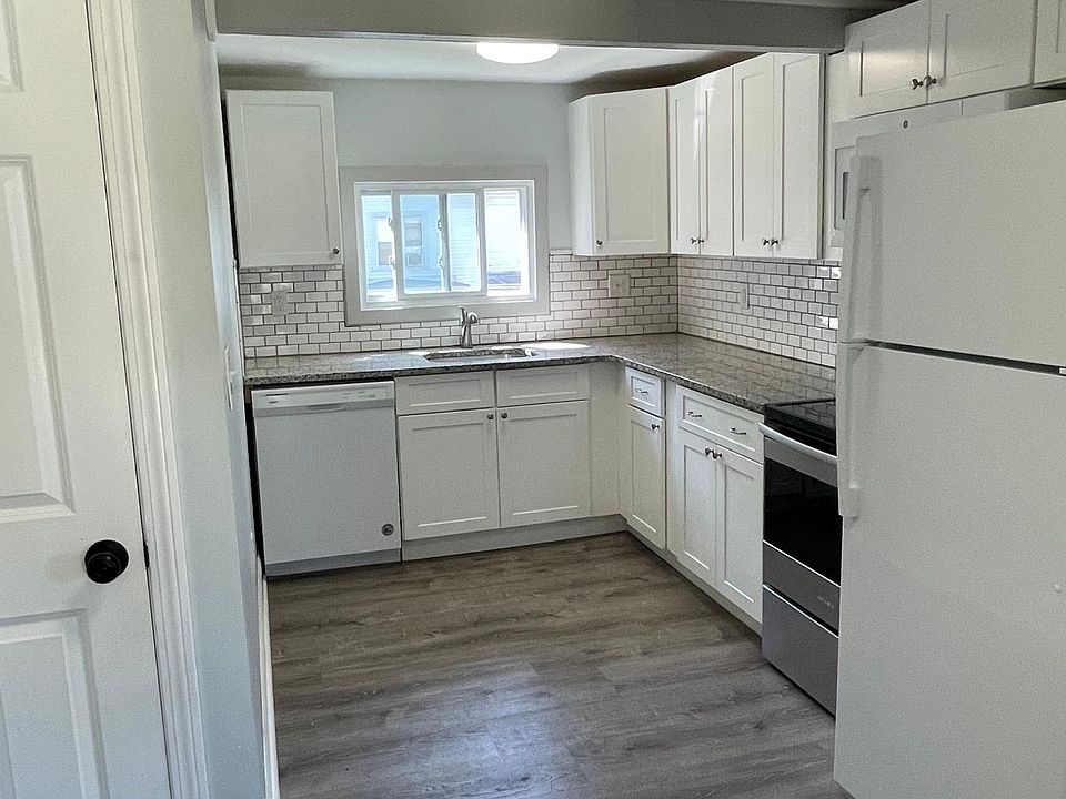 kitchen - granite countertops, subway tile, dishwasher, garbage disposal, electric range, refrigerator, microwave, soft close cabinets