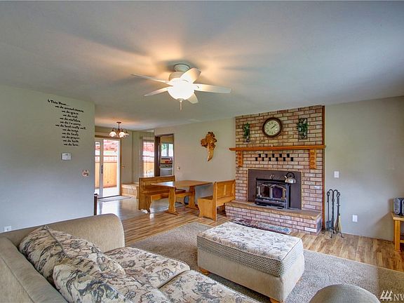 Main entry opens into a spacious living room with wood fire place. This room has a great cozy feel year round. 