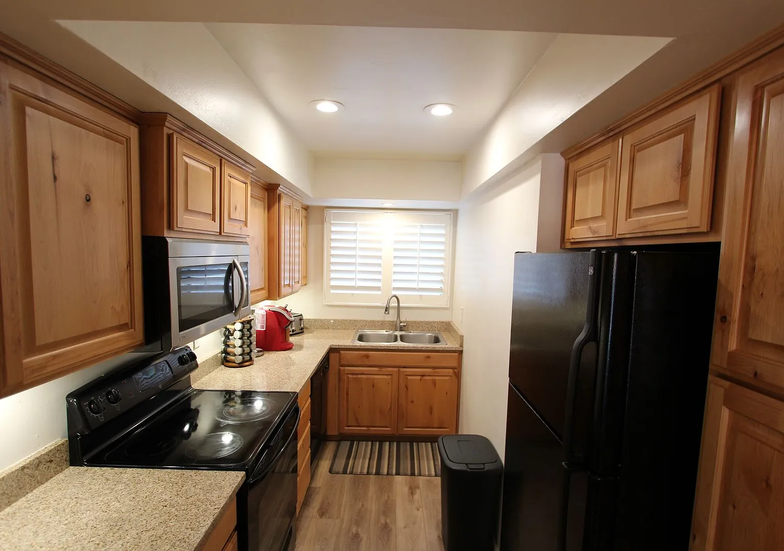 Price Improvement & $300 Move-In Special | Furnished Ground-Floor Condo with Small Fenced Yard — Photo 4