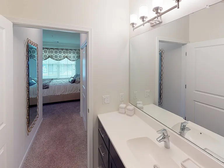 Upscale bathroom featuring quartz countertops