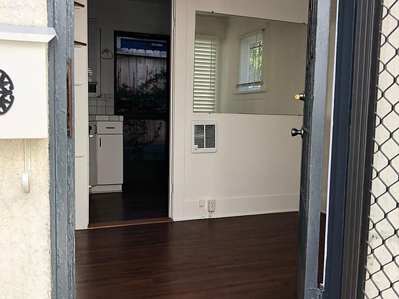 Front door looking into quaint living room