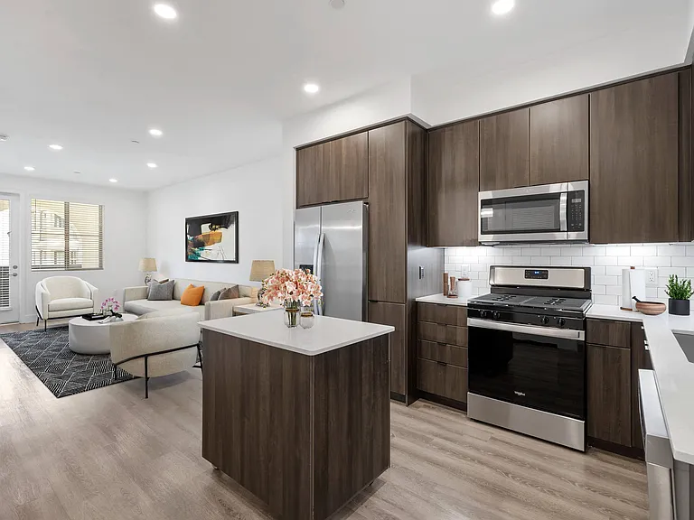 Indulge in gourmet chef-inspired kitchens, featuring sleek quartz countertops and a luxurious island for the ultimate cooking experience.