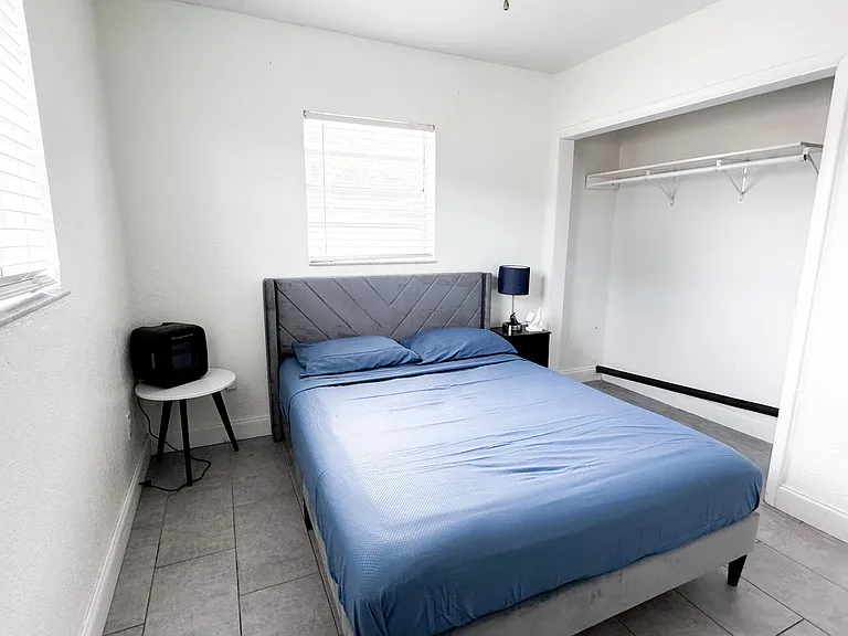 mini fridge, night stand and reach in closet