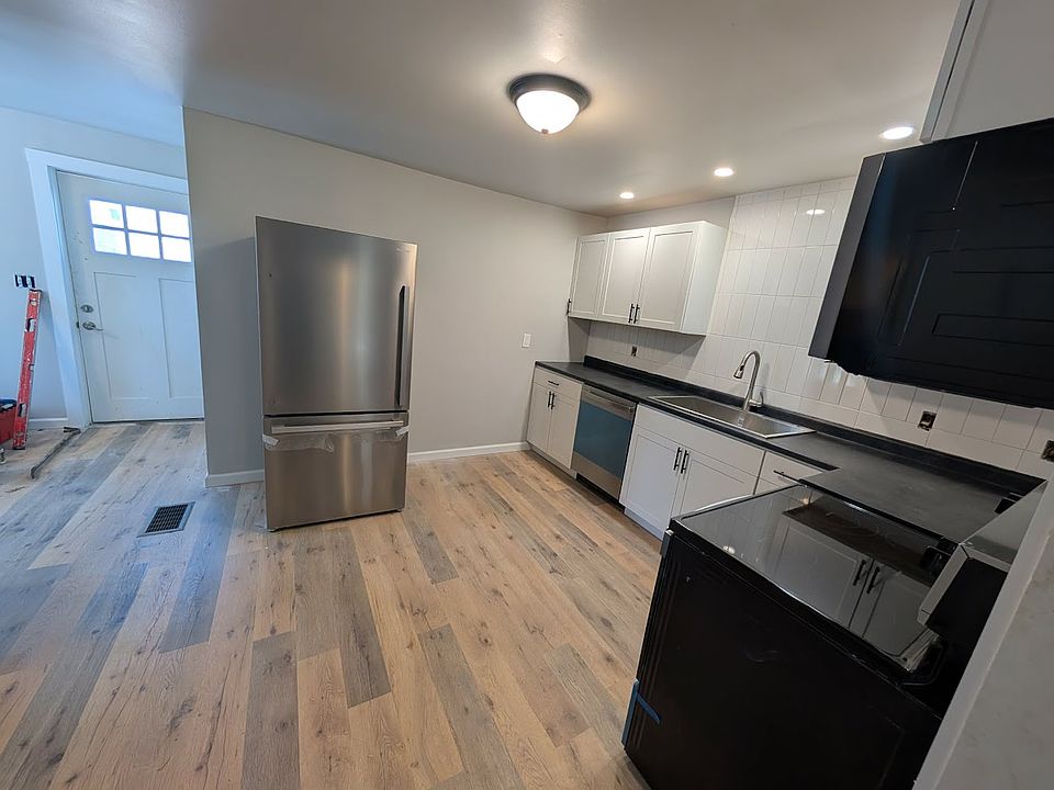 The kitchen has been recently renovated and includes brand-new stainless steel appliances.