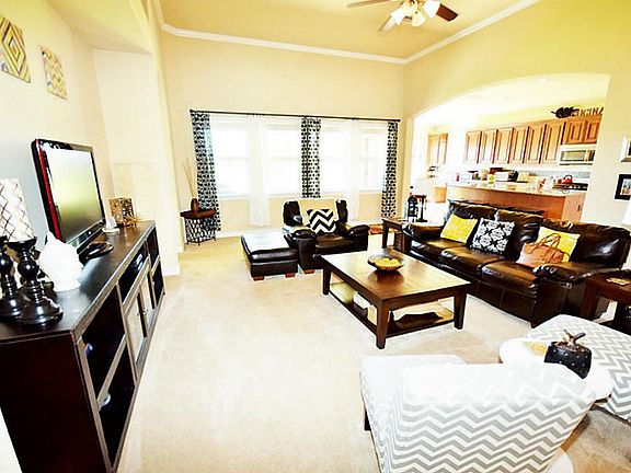 Large carpeted living room area.