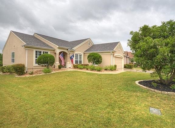Hugging the wooded banks of Berry Creek, this Sun City Texas Cortez Estate Home offers stone-edged planting beds, while the ultra-private back yard is a year-around treat!