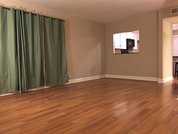 Living room with view into the kitchen.
