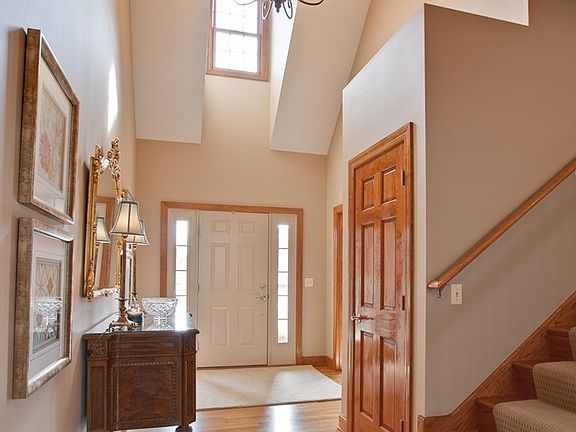 Welcoming formal 2 story foyer opens to the dining room or leads into the Great Room.
