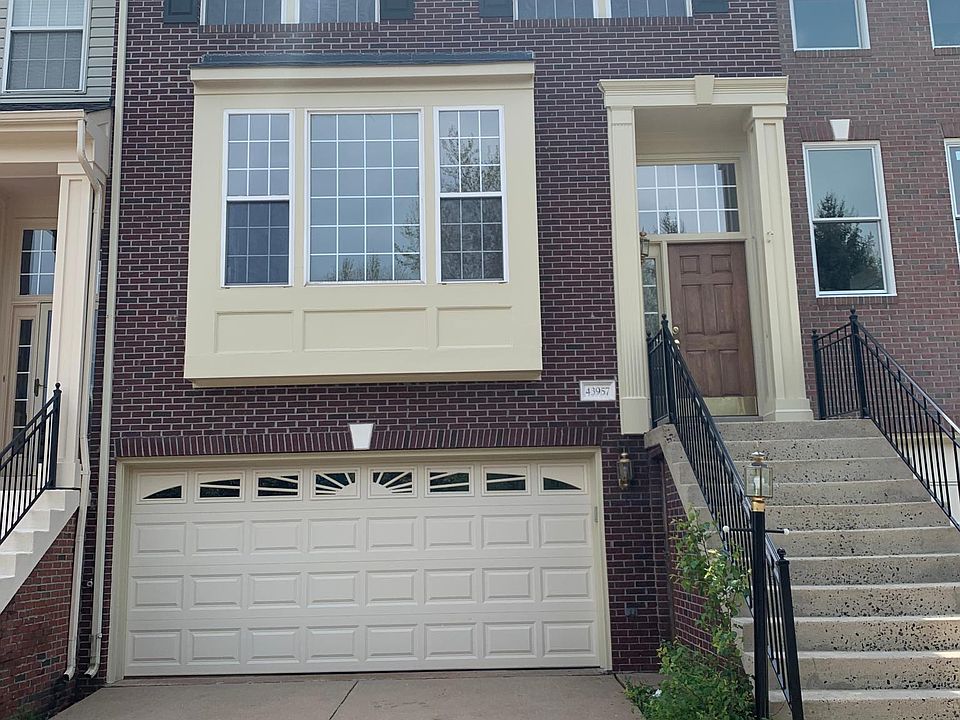 Front of townhouse with spacious 2 car garage and extra storage space