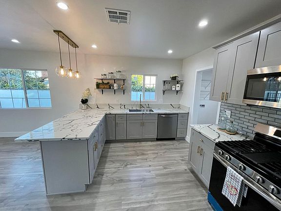 5th image of 8810 East Broadway