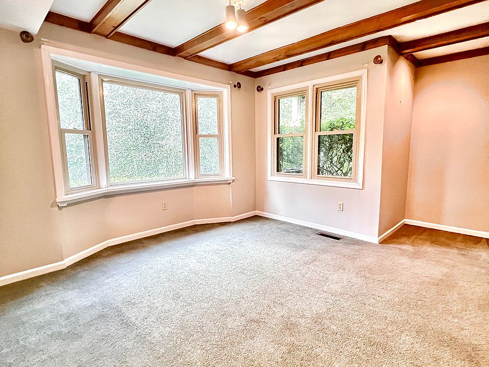 Bay window with view of woodlands.