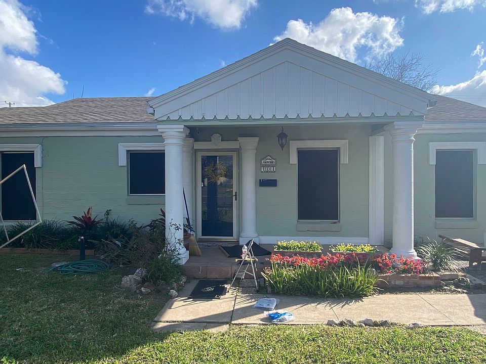 front of house, facing Boca Chica Blvd. Driveway parking for 2 cars with EV plug.