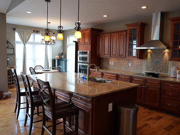 Large, open kitchen with granite countertops