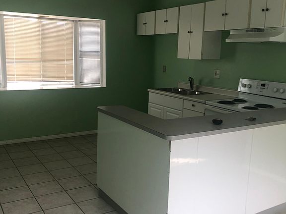 Combination of kitchen, dining and living room