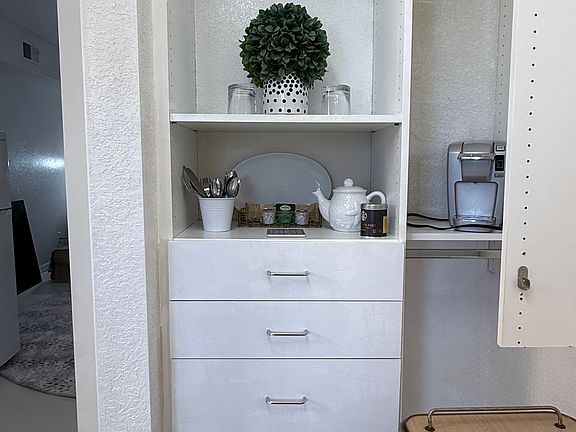 Coffee Maker, Teapot and a few teabags, coffee and even water to get you started.