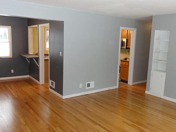 Living room opens to dining area
