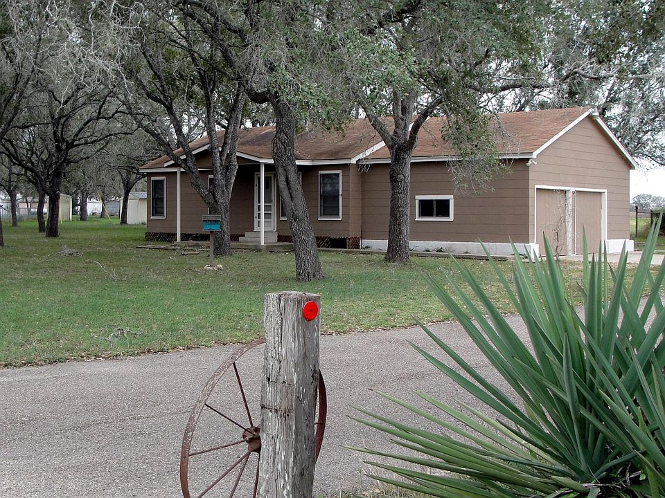 Front view. The home is fenced and has a security gate.