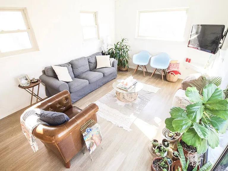 This is what we call the "sunroom". It was added on to the house before we purchased it and it's our favorite room in the house. It has 4 windows and sliding glass doors that lead to the patio and backyard.