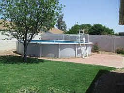 24 ft. rnd. above ground pool w/ red brick patio