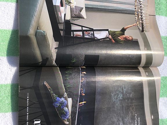 Photo of living and fireplace photographed from local magazine