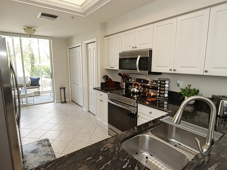 Fully equipped kitchen w/plenty of storage, granite countertops, and new stove and dishwasher