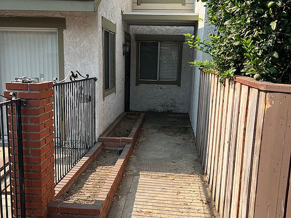 Front flower beds and walkway entrance to front door.