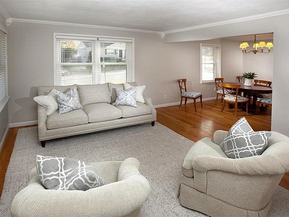 Light and bright living room and adjoining dining room.