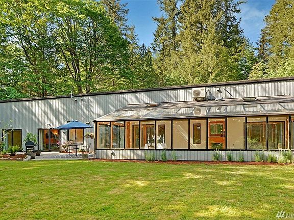 Multiple sliding glass doors and windows along the entire back side of the home to take advantage of the southern exposure.