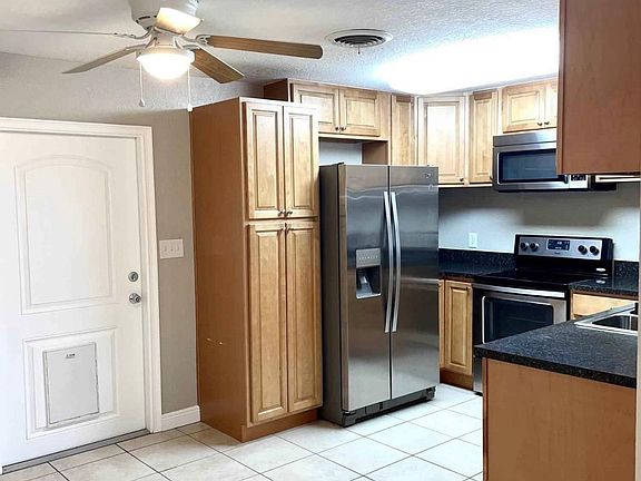 kitchen with access to enclosed back porch
