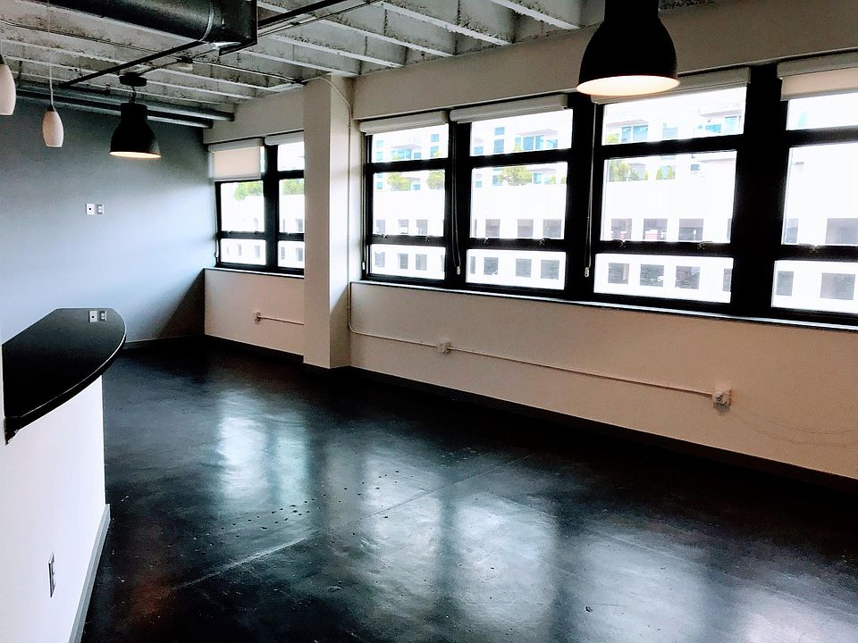 Open concept loft with beautiful lighting and city views