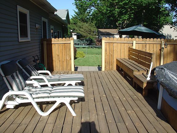 Fenced in deck area with pool