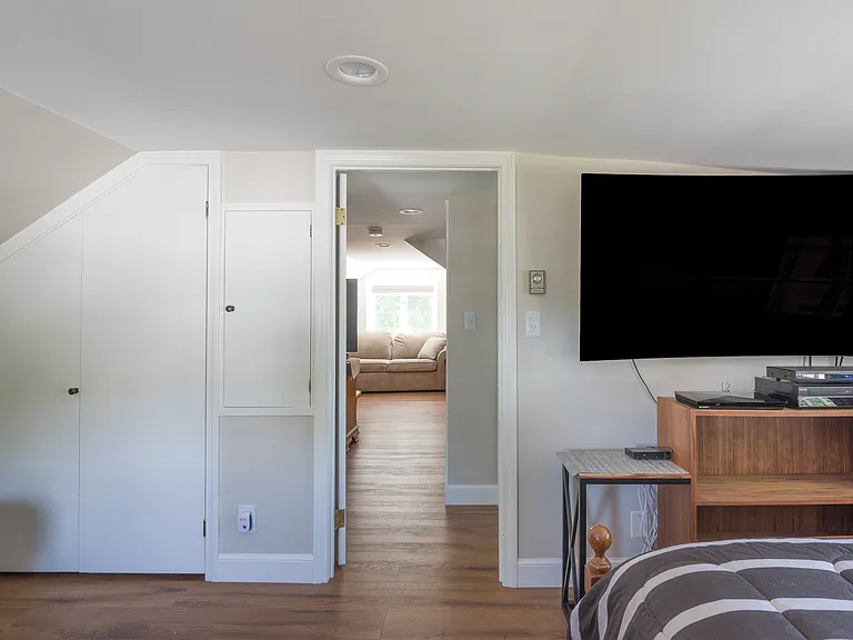 Bedroom separated from the living room by a hallway. Additional area in the bedroom for an office space.