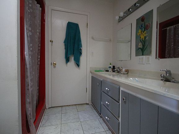 Shared bathroom with room next door.