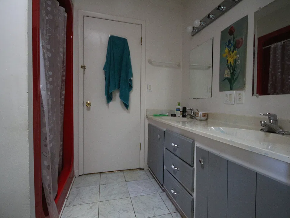 Shared bathroom with room next door.