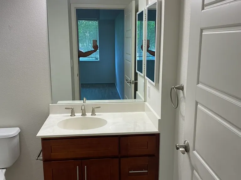 ensuite bathroom from primary room and standup shower
