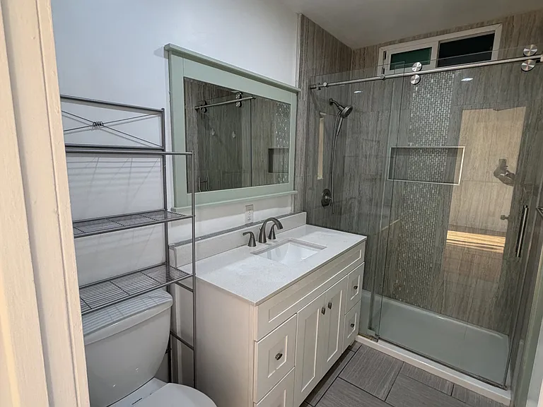 Primary en-suite bathroom; walk-in shower