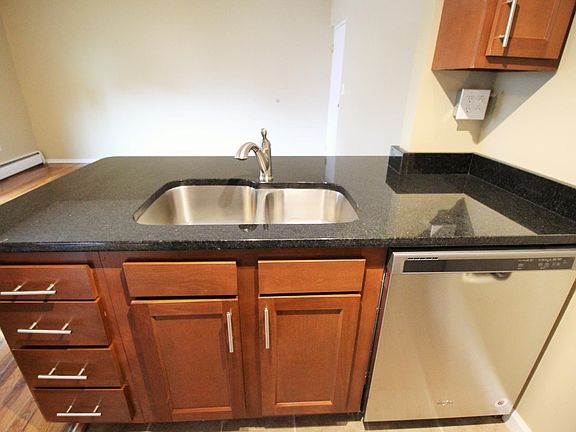 Front controlled dishwasher and drawers for storage.