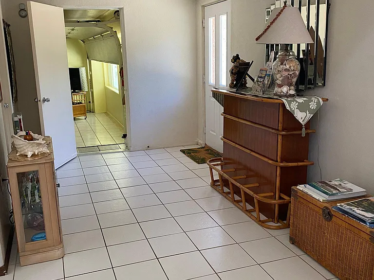 Entrance into living room, tile floors.