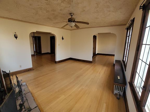 Living room looking into dining room and den