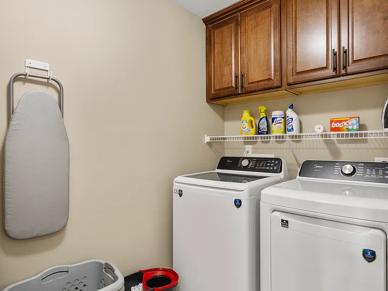 Laundry Room - includes use of Dyson Vacuum, broom, mop, iron and countertop ironing table