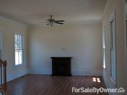 Living Room
						:
						Front door is to the right, kitchen to the rear, staircase to upstairs to left