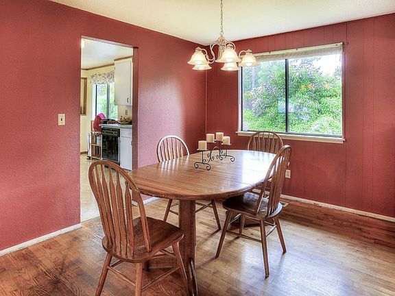 The dining room is just steps away from the sunny and bright kitchen.