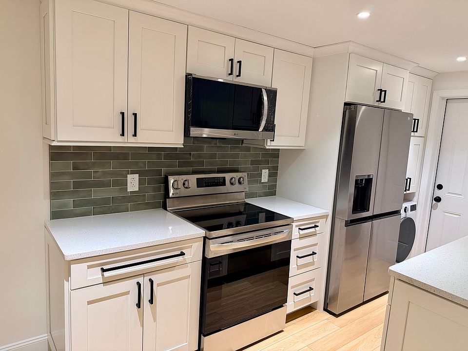 Newly remodeled kitchen - the appliances still have the protective film, ready to be unwrapped by the first tenant in this unit!