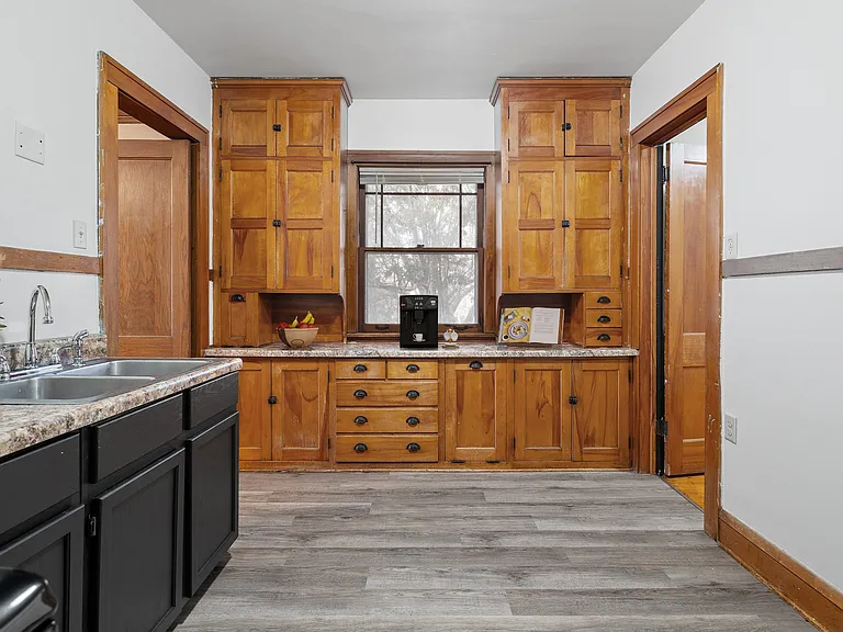 Step into the heart of Central Lakes of Uptown, where modern amenities meet timeless charm. This inviting kitchen boasts rich wood cabinetry and sleek finishes, perfect for culinary enthusiasts. Schedule your tour today and make it yours!