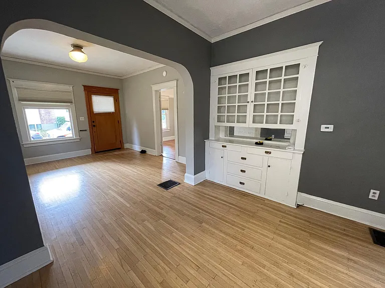 Dining room off of kitchen with built in hutch