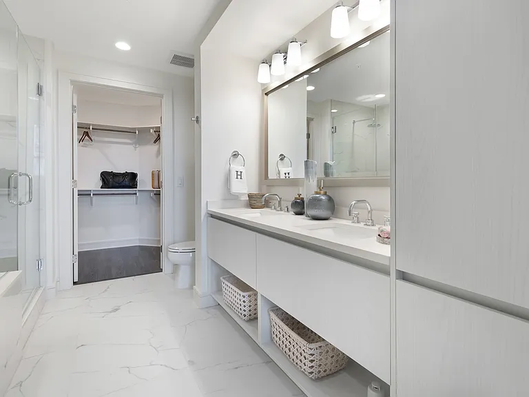 Spa-inspired bathrooms with double-vanities and ample storage space