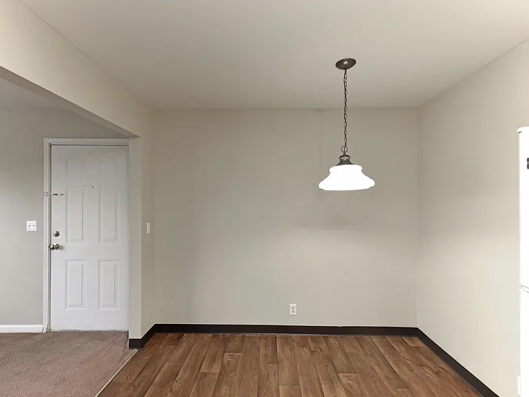 Dining area with hardwood-style flooring