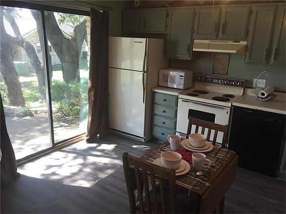 Kitchen with view of rear patio