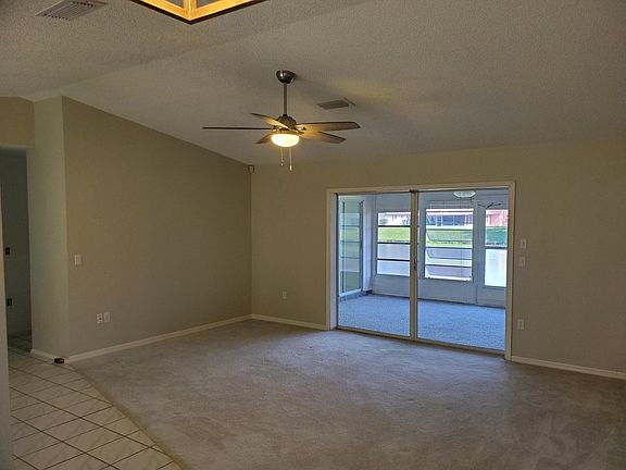 Family room. New paint, ceiling fan, and lighting.