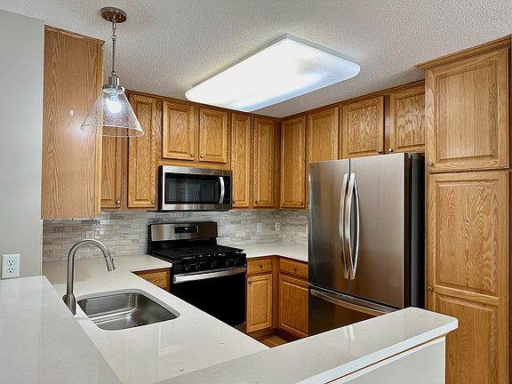 Updated kitchen with new counters, back splash and appliances